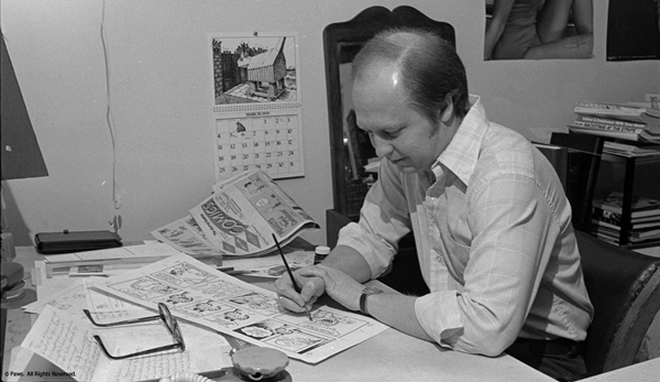 Jim Davis at the drawing desk