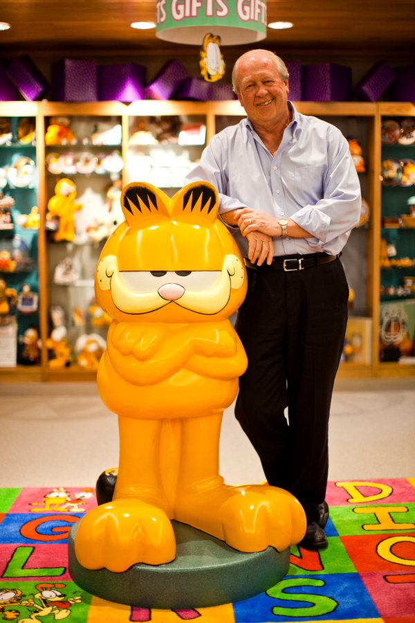 Jim Davis surrounded by merchandise